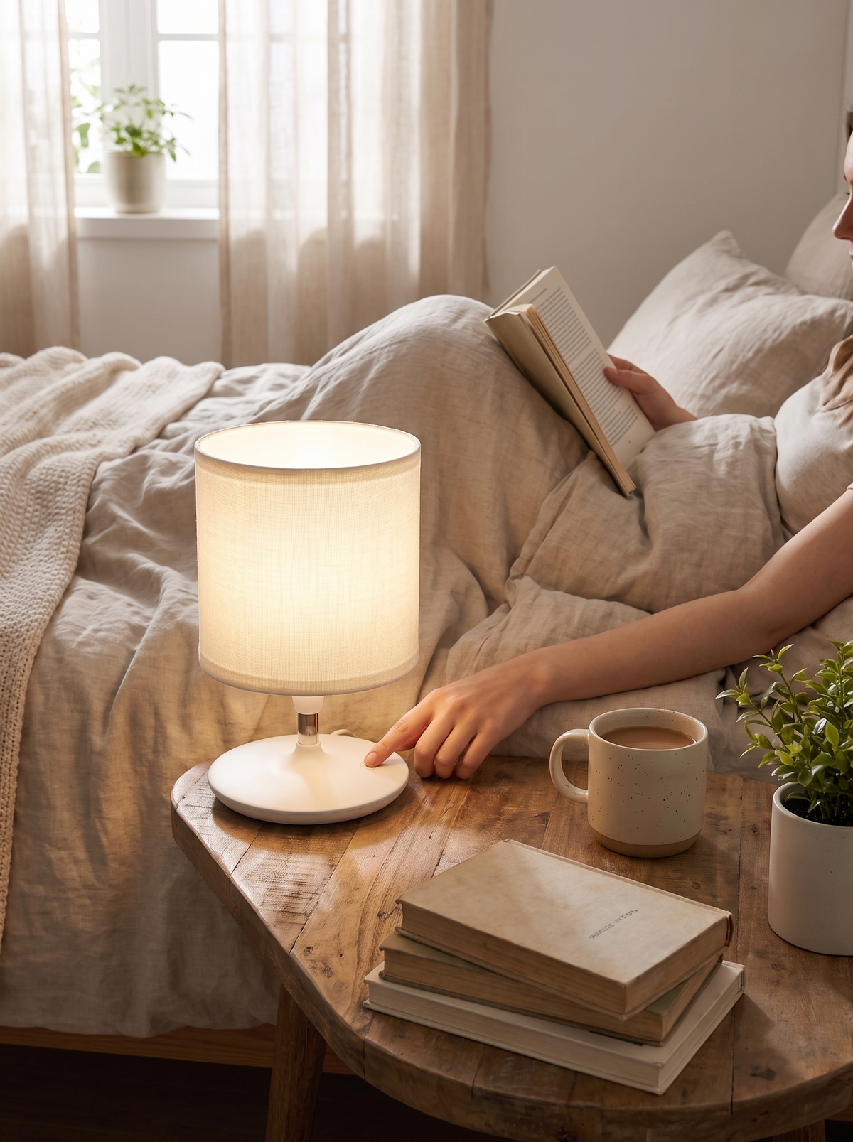 Linen shade diffusing warm light across a bedroom nightstand